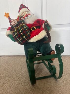 Santa on Green Metal Sleigh